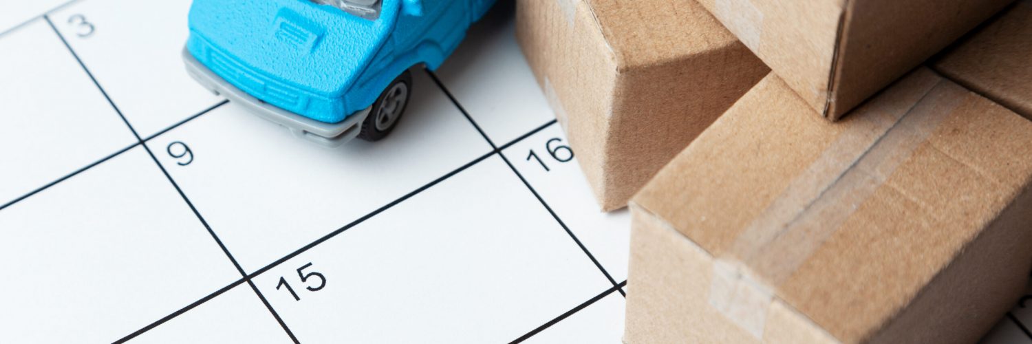 Moving day. Calendar for note with cardboard boxes and truck.